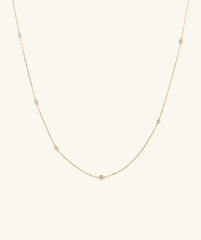 Multi Station Round Diamond Necklace featuring six round bezel set diamonds on a diamond cut cable chain, showcasing maximum shine from every angle.