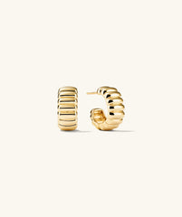 Charlotte Bold Hoops: A pair of elegant gold hoop earrings, showcasing a refined design, perfect for adding a touch of sophistication to any outfit.