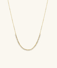 Diamond Half Tennis Necklace: A close-up of a handcrafted 14k gold chain adorned with responsibly sourced diamonds, capturing a sparkling elegance in its design.