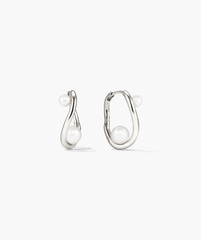 Dôme Figure Pearl Hoops featuring interwoven pearls of varying sizes on elegant hoops, ideal for versatile styling at any occasion.