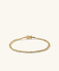 Diamond Tennis Bracelet 1.3mm, 14k gold with diamonds, featuring a secure clasp and safety arms for fastening. Handcrafted for timeless elegance.