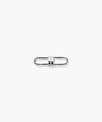 Mejuri Custom Chain Enhancer: A close-up of a silver metal clasp designed to attach to various chains for added versatility and style.