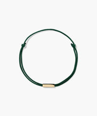 Bar Cord Bracelet featuring a green string with a gold bar, ideal for adding a signature touch to your fashion accessories.