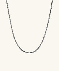 2.4mm Wheat Chain Necklace, intricately woven and handcrafted in oxidized sterling silver, showcasing a detailed close-up of the chain's texture and design.