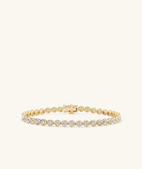 Micro-Pavé Diamond Rivière Bracelet in 14k gold, featuring 176 hand-set diamonds in knife edge bezel setting, showcasing a continuous stream of sparkle.