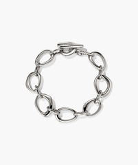 Organic Dôme Ripple Chain Bracelet featuring interlinked open shapes and a toggle clasp, showcasing an elegant, wearable design.