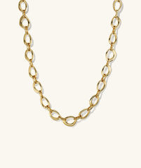 Organic Dôme Ripple Chain Necklace featuring organic, irregular oval links with a toggle clasp, showcasing a fluid design that enhances any outfit.