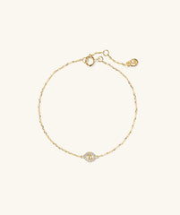 Pavé Diamond Evil Eye Bracelet featuring a gold band adorned with a diamond-studded evil eye pendant, symbolizing protection against negativity.