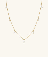 Tiny Pearl Station Necklace: An 18k gold vermeil chain adorned with evenly spaced freshwater pearls, showcasing a delicate and elegant design.