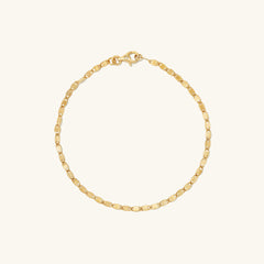 Anchor Chain Anklet: 14k solid gold chain with interlinked design, resembling a ship's anchor chain, displayed on a plain white background.