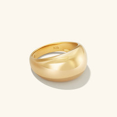 Gold Dôme Ring with a bold design, casting a shadow. Ideal for stacking with daintier rings.