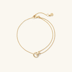 Linked Bracelet featuring two interlinked rings, handcrafted in 14k gold, symbolizing the strength of personal bonds.