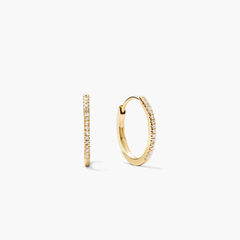Pavé Diamond Small Hoops: Slim yellow-gold hoops with front-facing white stones, shown in profile and angled, handcrafted in recycled 14k gold for versatile, elegant styling.