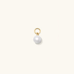 Single Pearl Hoop Charm: A close-up image showcasing a single pearl charm designed to personalize and enhance your hoop earrings for a versatile, high-impact accessory.