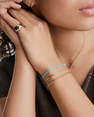 Anya Turquoise Beaded Bracelet featuring playful mini beads, ideal for stacking, offering a vibrant addition to any accessory collection.