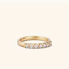 Bold Diamond Half Eternity Ring in 14k gold, featuring seven round cut diamonds, showcased in a close-up view highlighting its elegant design and craftsmanship.