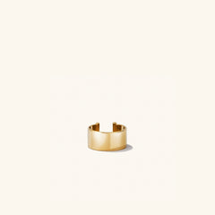 Daily Ear Cuff in vermeil, showcasing a polished, high-impact shine on a white background, reflecting its classic, handcrafted design.