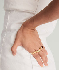 Close-up of a hand wearing the Heirloom Ring, showcasing its intricate design and elegant craftsmanship.