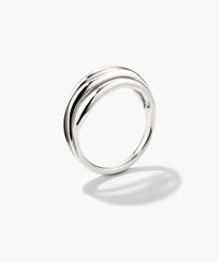 Bold Open Dôme Ring: A polished silver band with subtle wave detail, embodying open spaces and asymmetrical design for a striking yet minimalist statement.