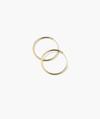 Between Hoops: Handcrafted 14k gold hoop earrings, lightweight and suitable for daily wear, including swimming.
