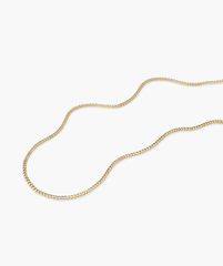 Curb Chain Necklace, 14k solid gold, displayed on a white surface. Handcrafted for daily wear, this shorter chain complements longer necklaces perfectly.