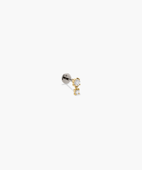 Close-up of the Piercing Studio - Diamond Droplet Stud, showcasing a delicate design with a shimmering diamond accent, perfect for an elegant, modern look.