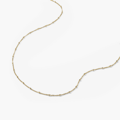 Spheres Chain Necklace: Minimal gold chain with spherical beads, versatile for any occasion.