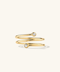 Diamond Coil Ring: 14k gold ring with pavé diamonds, giving the appearance of multiple rings in one. Handcrafted and featuring responsibly sourced gemstones.