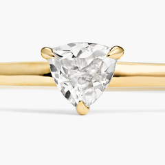Close-up of the Gemstone Trillion Stacker Ring, featuring a white topaz gemstone set in handcrafted 14k solid gold.