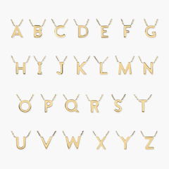 Gold letter necklace with a delicate chain, showcasing various initials. Perfect for personalizing your look with an upgraded, stylish initial necklace.