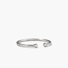 Diamonds Open Ring: A silver ring featuring an open design with two bezel-set diamonds, perfect for stacking with other rings like Stacker, Twist, or Beaded Rings.