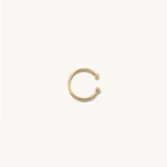Essential Cuff: A handcrafted 14k solid gold ear cuff featuring a sleek, circular design with a polished ball accent, perfect for enhancing any jewelry stack.