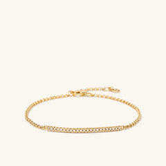 Pave Diamond Bar Bracelet featuring a gold chain adorned with diamonds, exemplifying elegance and sophistication as a fashionable jewelry piece.
