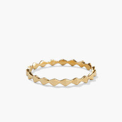 Sculpture Ring with a zig-zag patterned gold band, designed for solo wear or stacking, making a bold artistic statement.