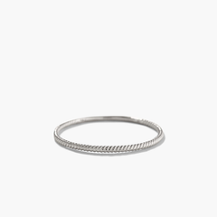 Twist Ring: a 1.3 mm silver ring featuring a braided edge, designed for daily wear with a unique twisted pattern.