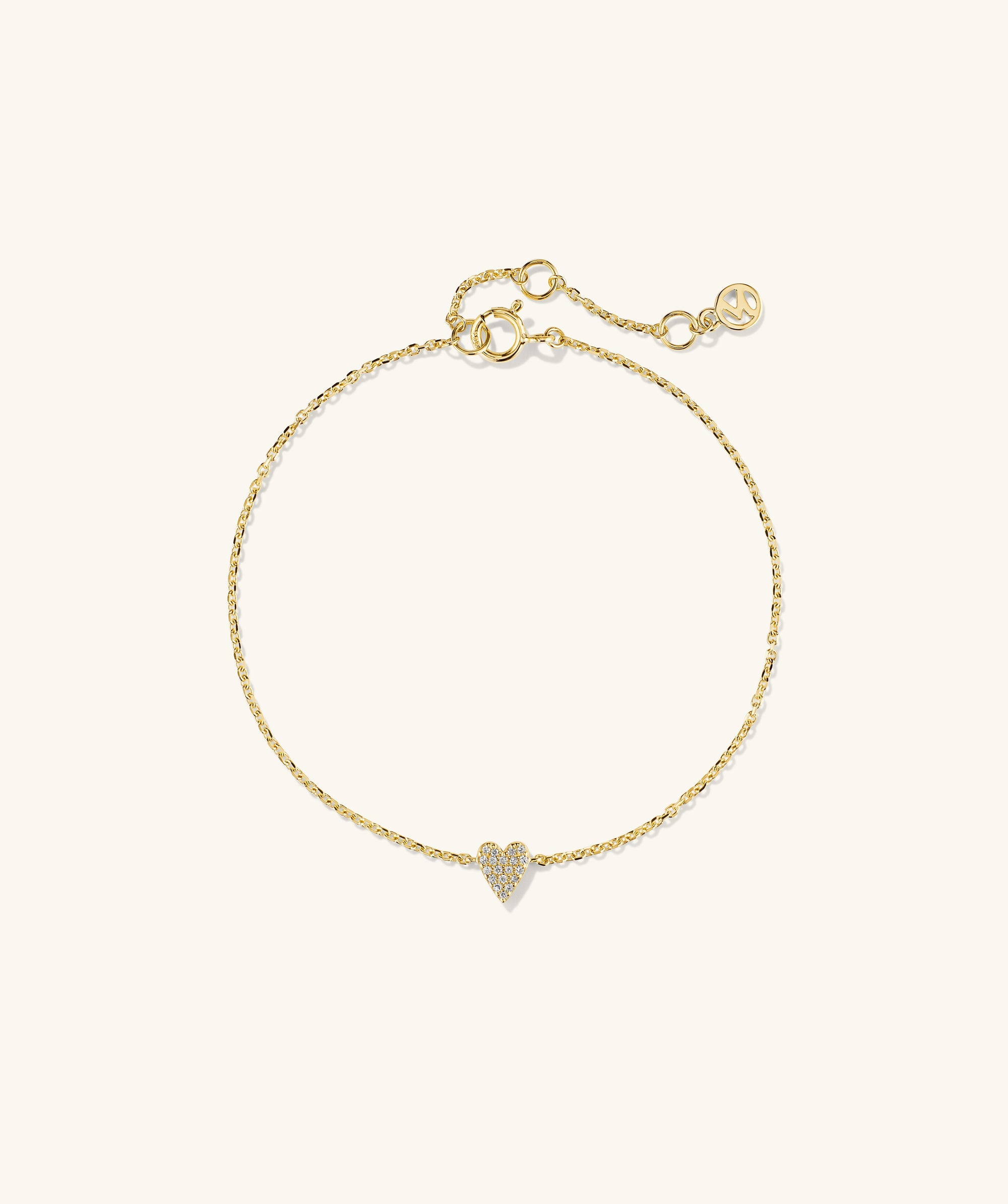 Mini Heart PavÃ© Diamond Bracelet featuring a gold chain with a heart-shaped pendant adorned with diamonds, perfect for a playful statement.