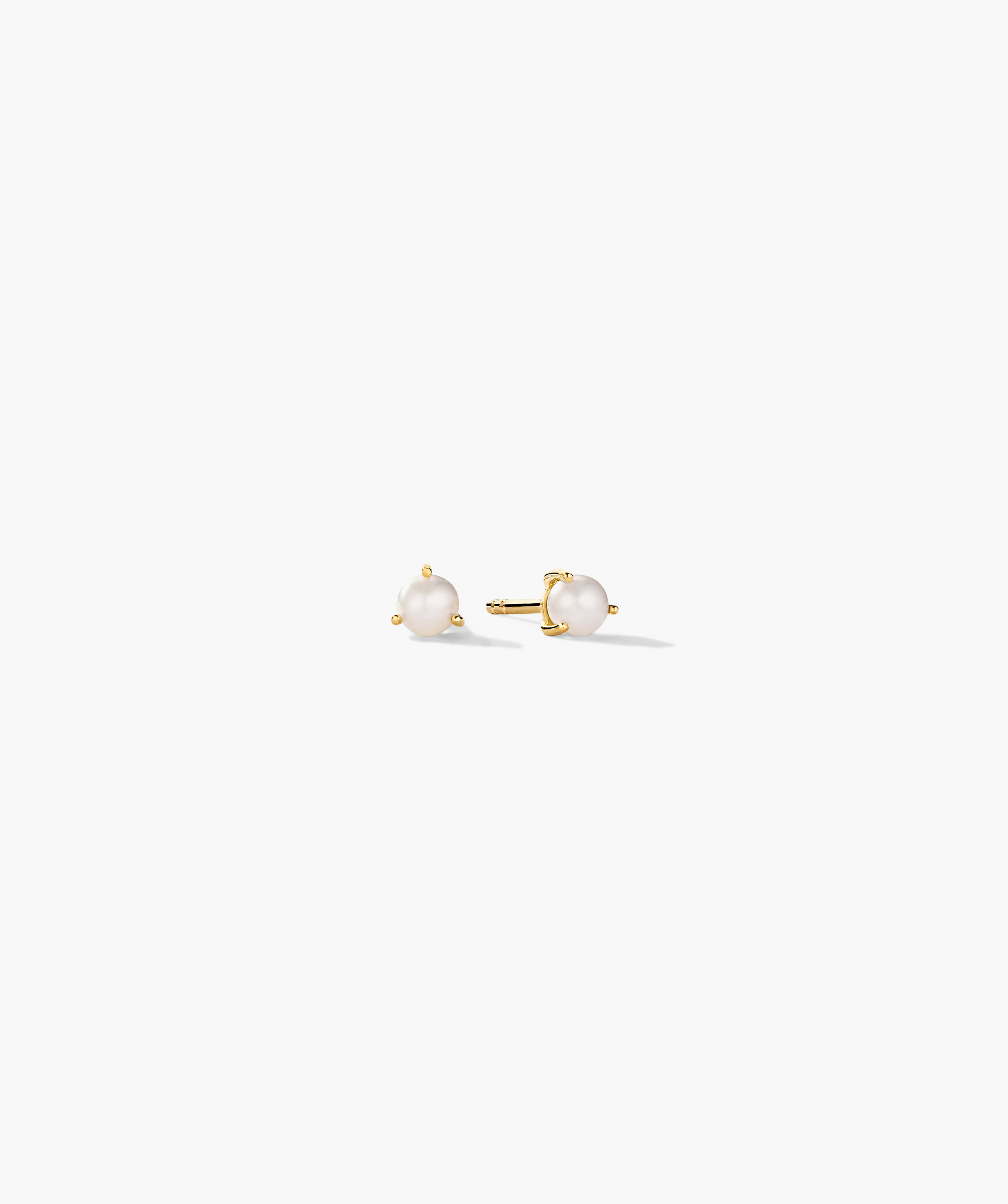 Gemstone Mini Studs (Copy): Simple stud earrings with round white pearls in a three-prong yellow-gold setting, featuring straight post backings.