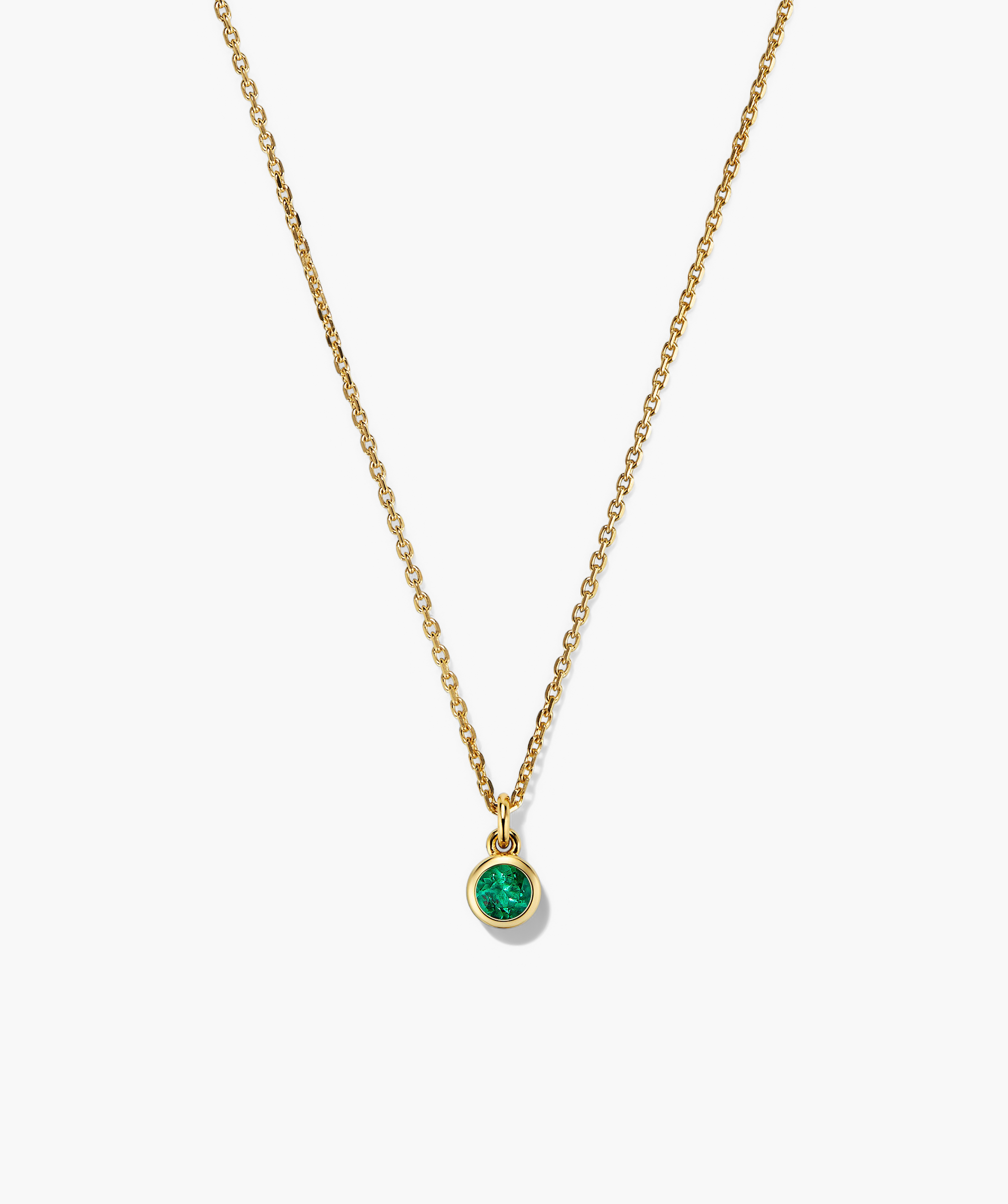 Sia Birthstone Pendant Necklace featuring a gold chain with a green stone pendant, perfect for adding a personal touch or gifting.