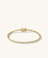 Diamond Tennis Bracelet 1.8mm: A close-up of a gold bracelet adorned with diamonds, featuring a secure clasp mechanism and handcrafted in 14k solid gold.