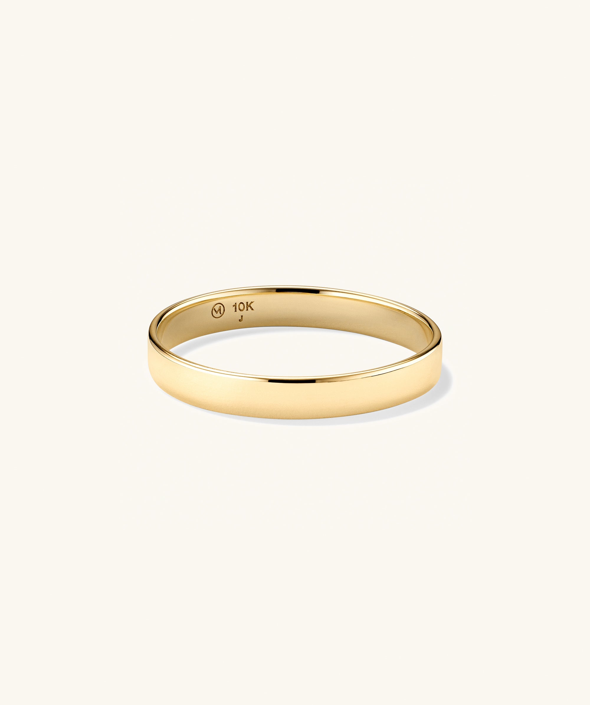 Bold Stacker: A polished 10-karat yellow gold band with a 10K stamp inside, perfect for daily wear and pairing with other Stacker rings.