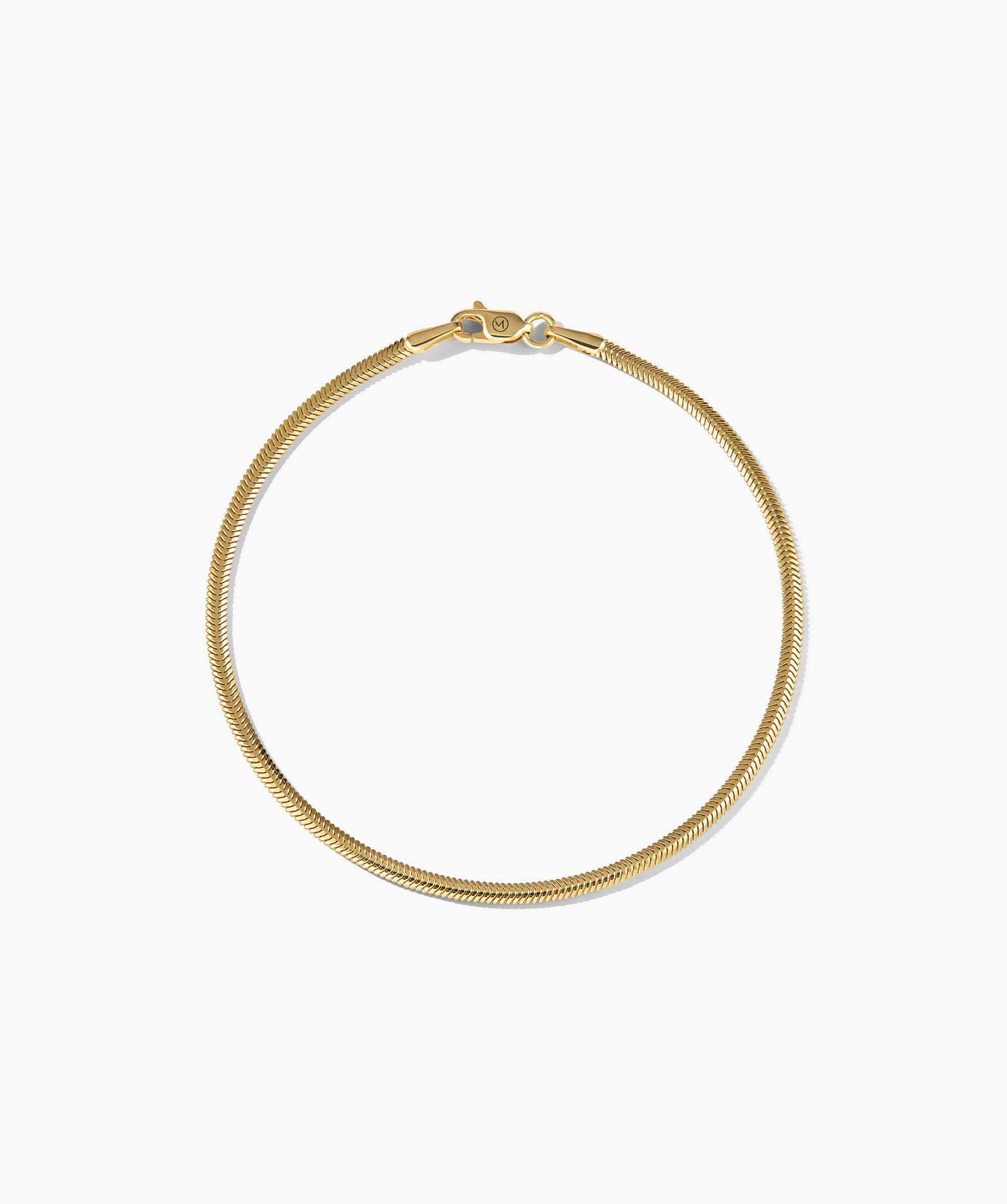 Cobra Bracelet with a smooth texture, featuring a gold chain design and clasp, elegantly displayed on a black background.