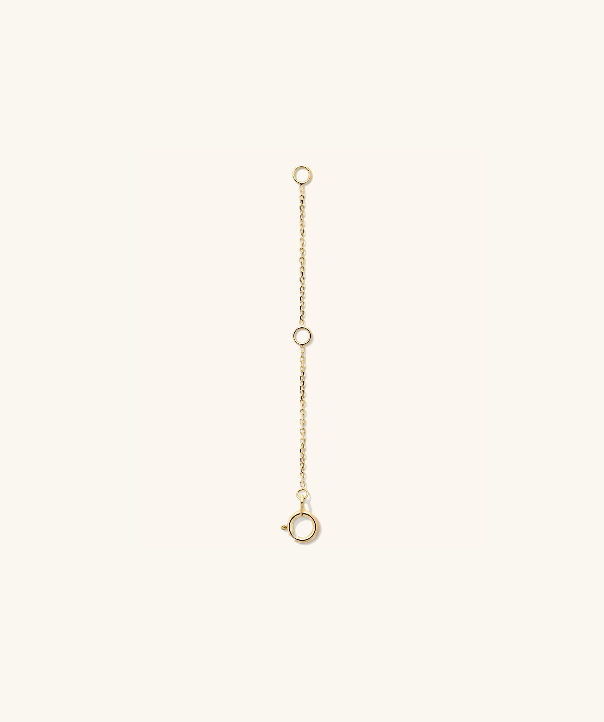 Gold Chain Double Extender featuring circular links, shown in close-up, designed to add length and versatility to your jewelry styling.