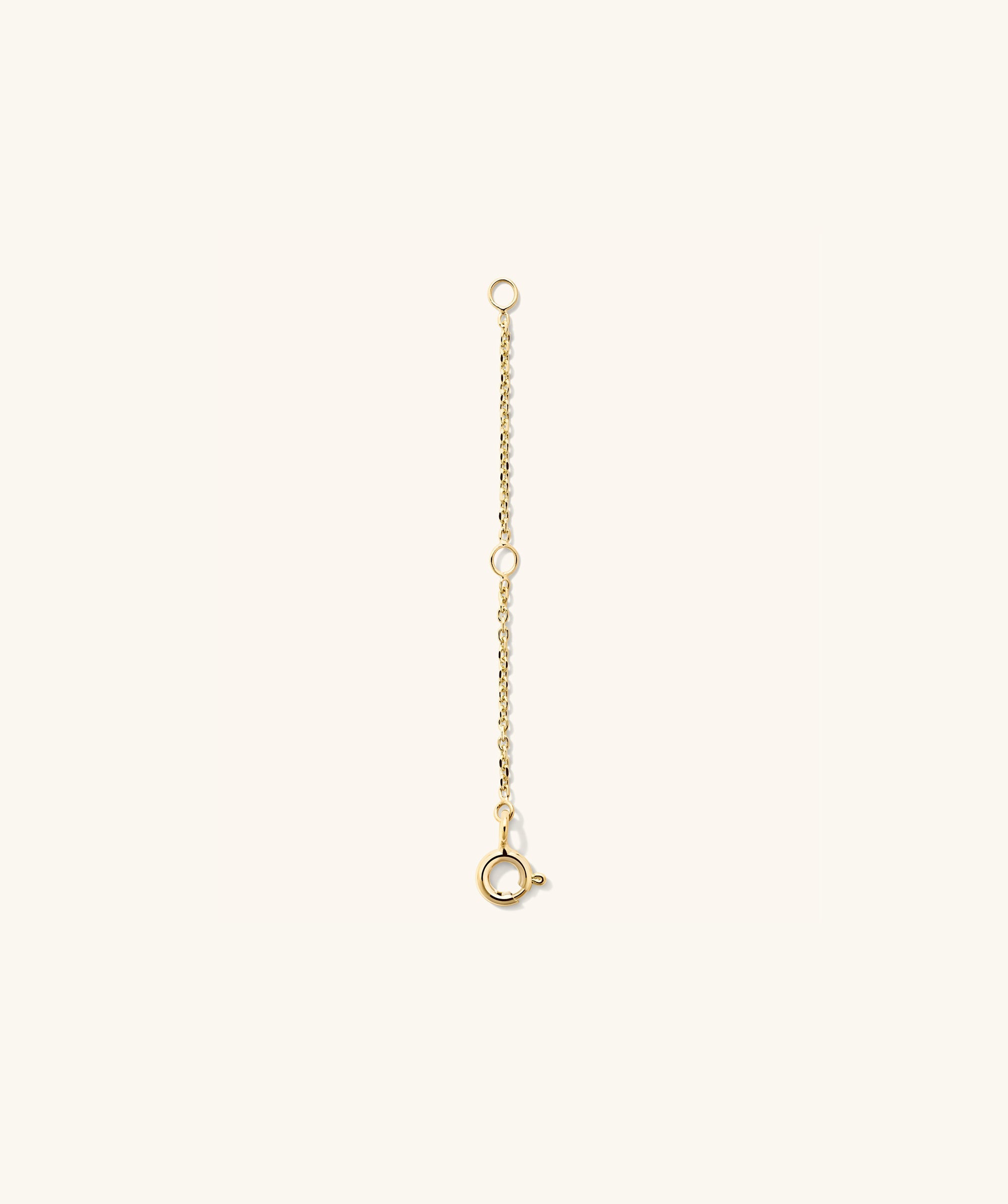 Gold Chain Double Extender featuring circular links, designed to add length and versatility to your jewelry. Ideal for enhancing and personalizing your favorite chains.