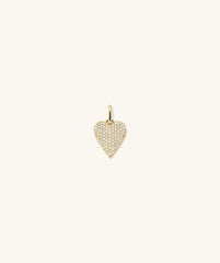 PavÃ© Diamond Heart Pendant: A close-up of a gold heart-shaped pendant adorned with diamonds, showcasing its elegant design and timeless appeal.