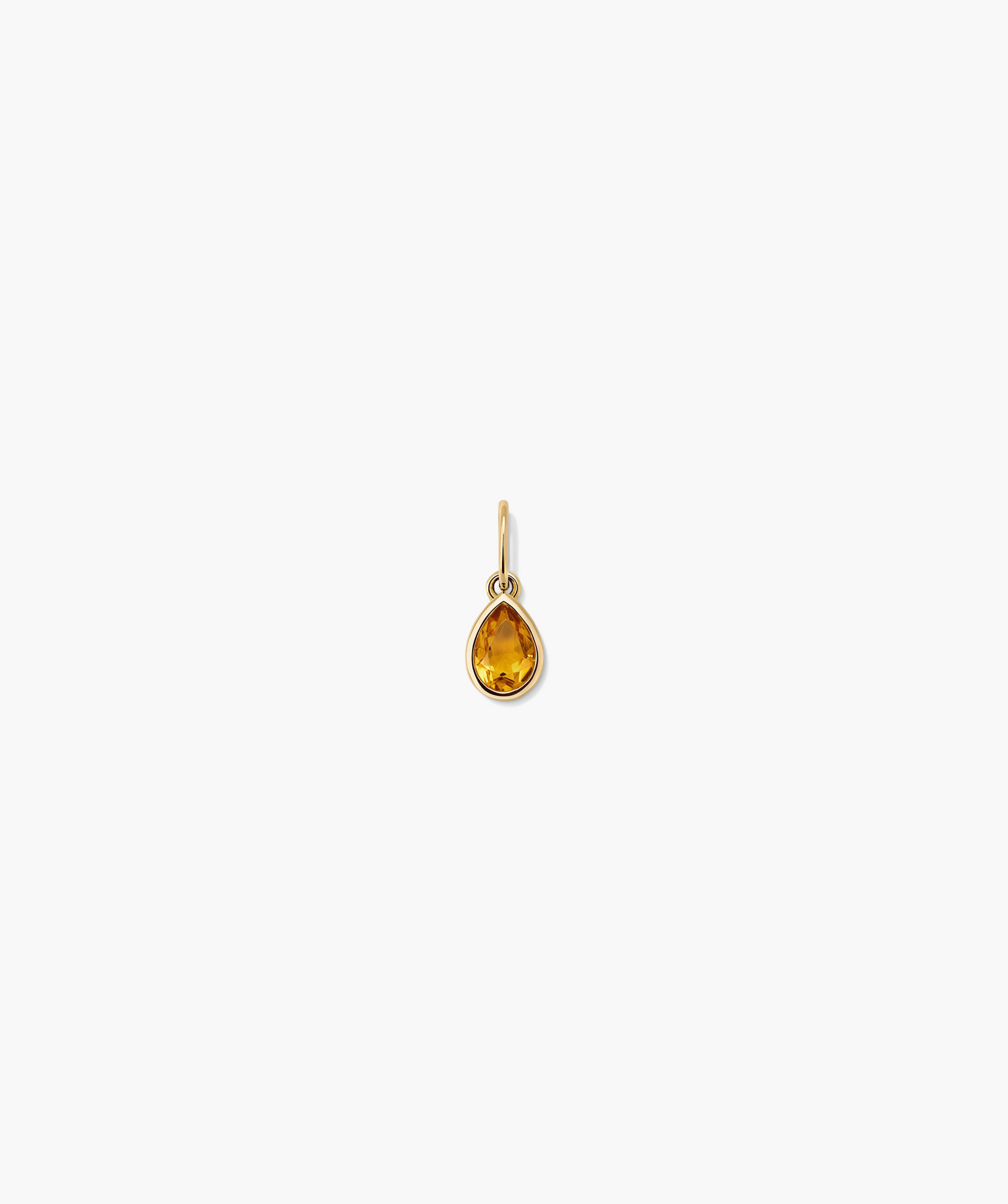 Close-up of the Small Pear Pendant, showcasing its elegant shape and shine, perfect for adding a fresh touch to everyday jewelry.