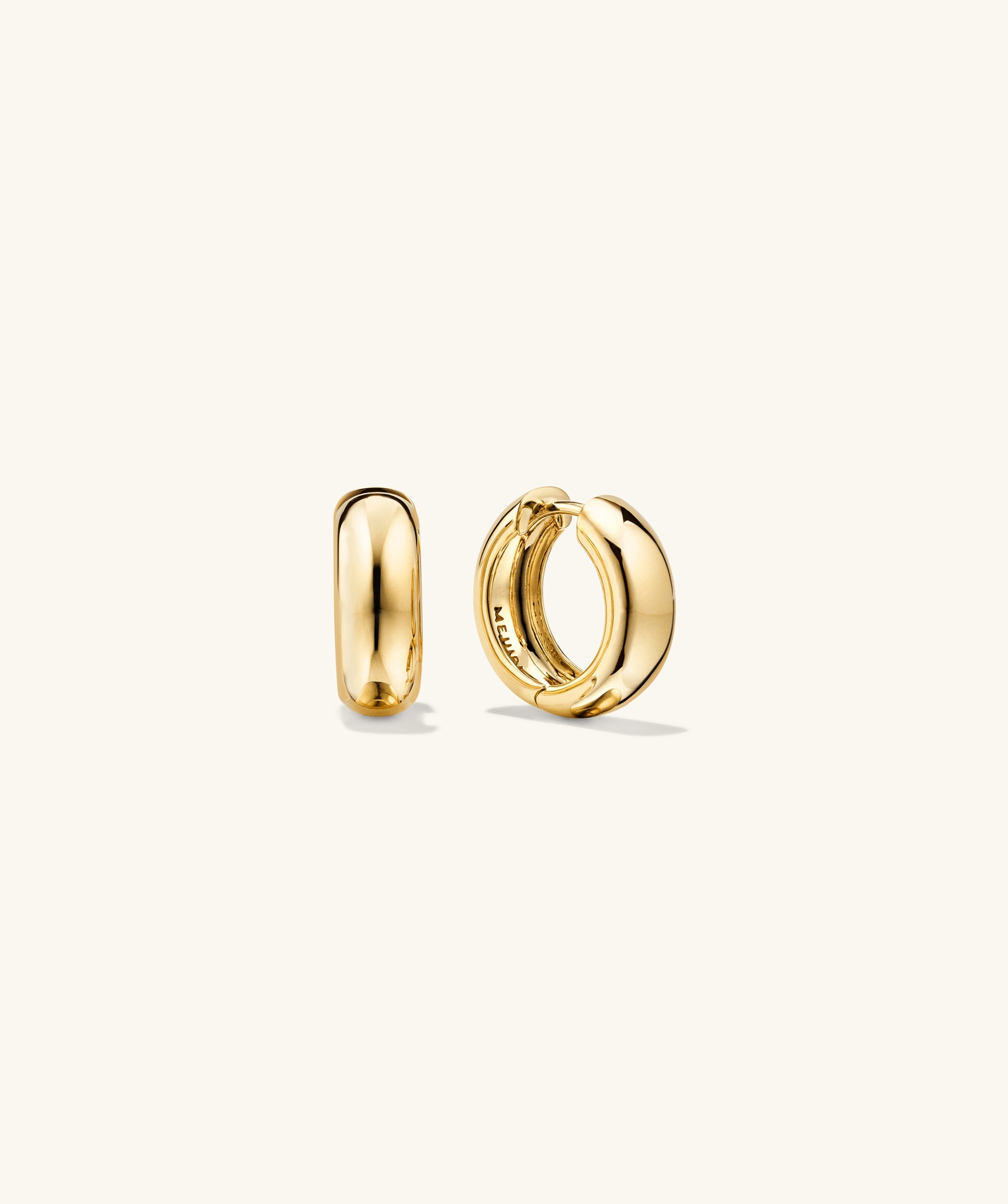 Plush Small Hoops, handcrafted 14k gold, perfectly pillowy design, displayed as a pair of gold hoop earrings. Ideal for those seeking a bold accessory.