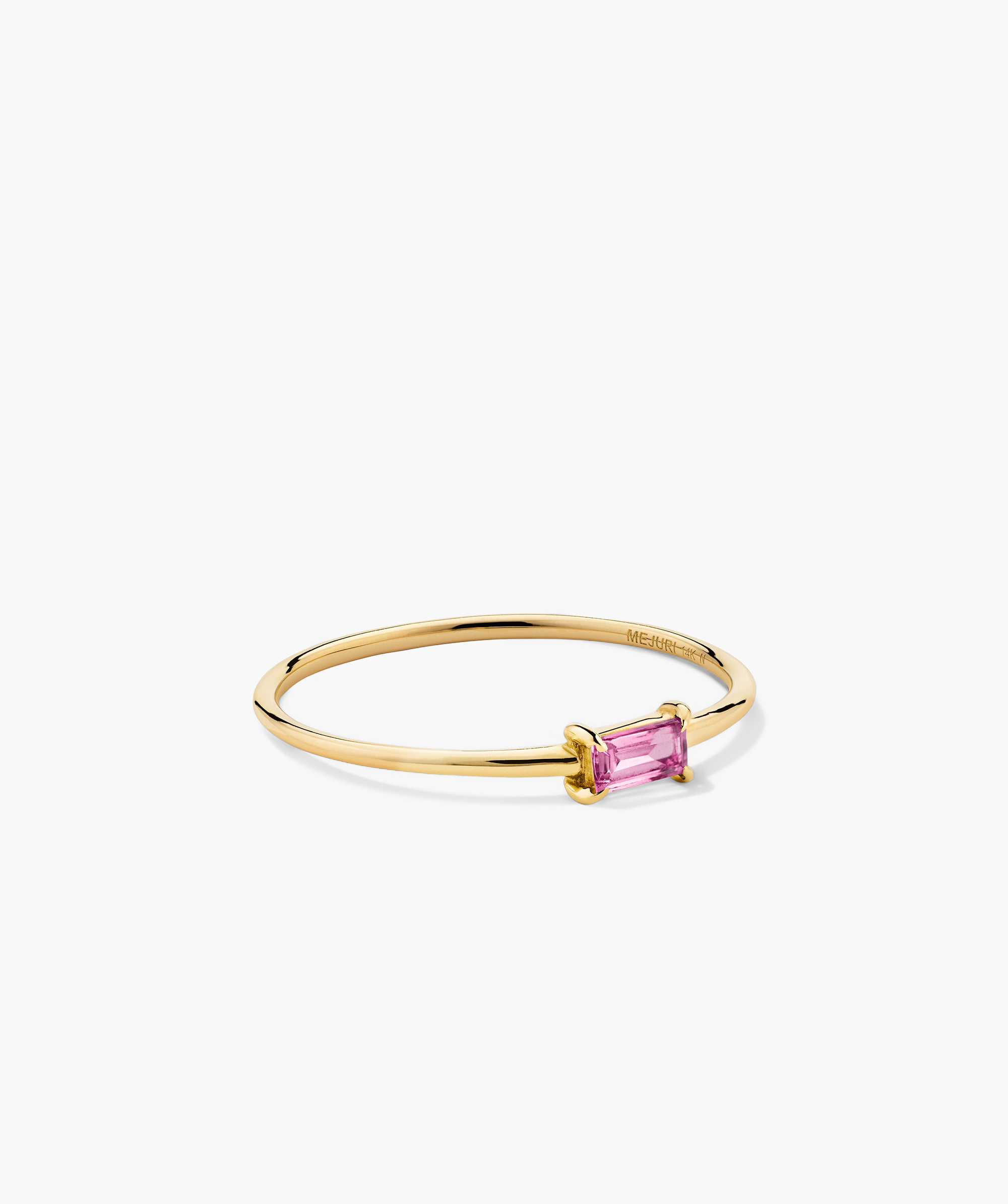 Baguette Stacker Ring: Gold ring featuring a prominent pink stone, designed as a fashionable accessory perfect for stacking or standalone elegance.