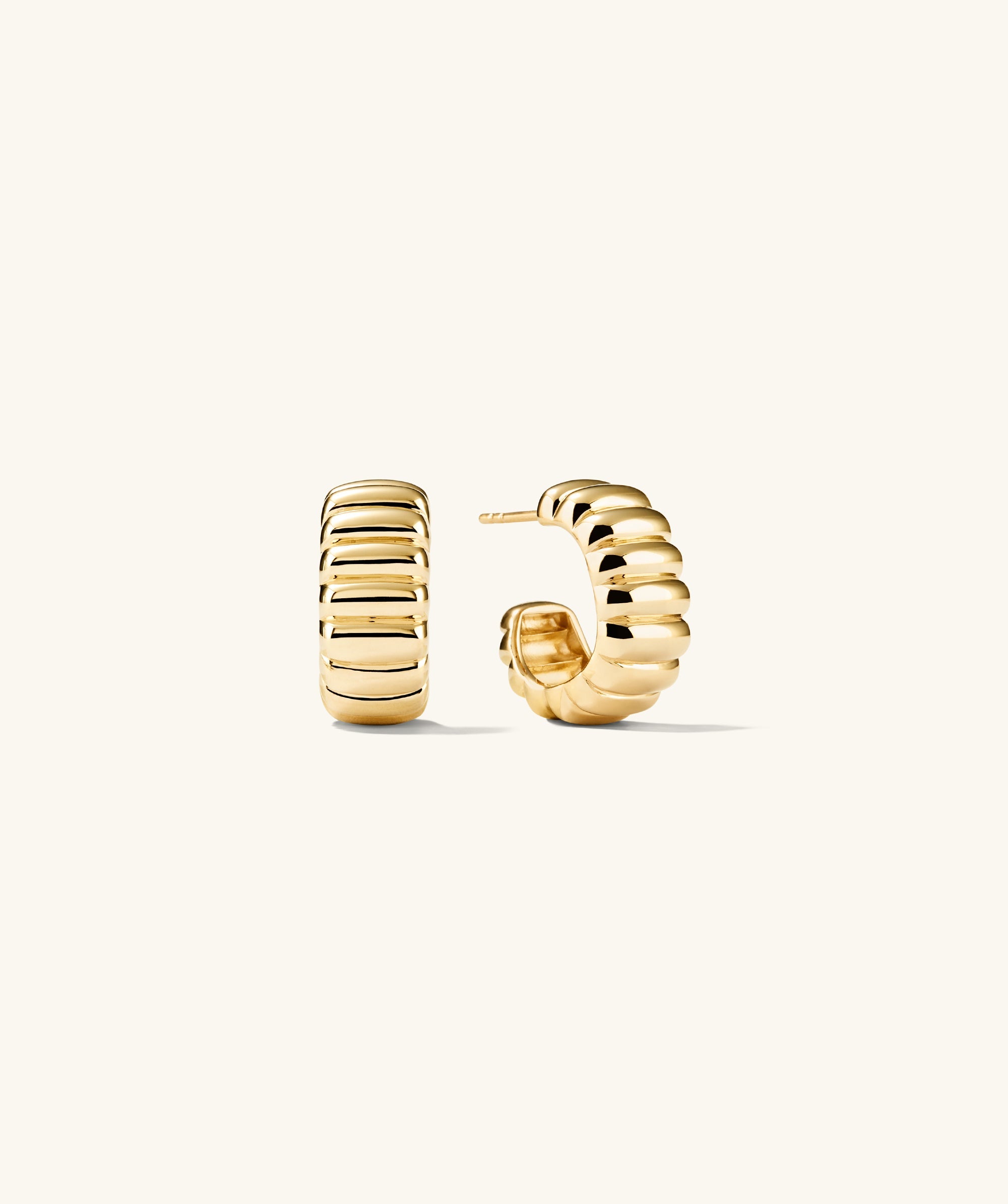 Charlotte Bold Hoops: A pair of elegant gold hoop earrings, showcasing a refined design, perfect for adding a touch of sophistication to any outfit.