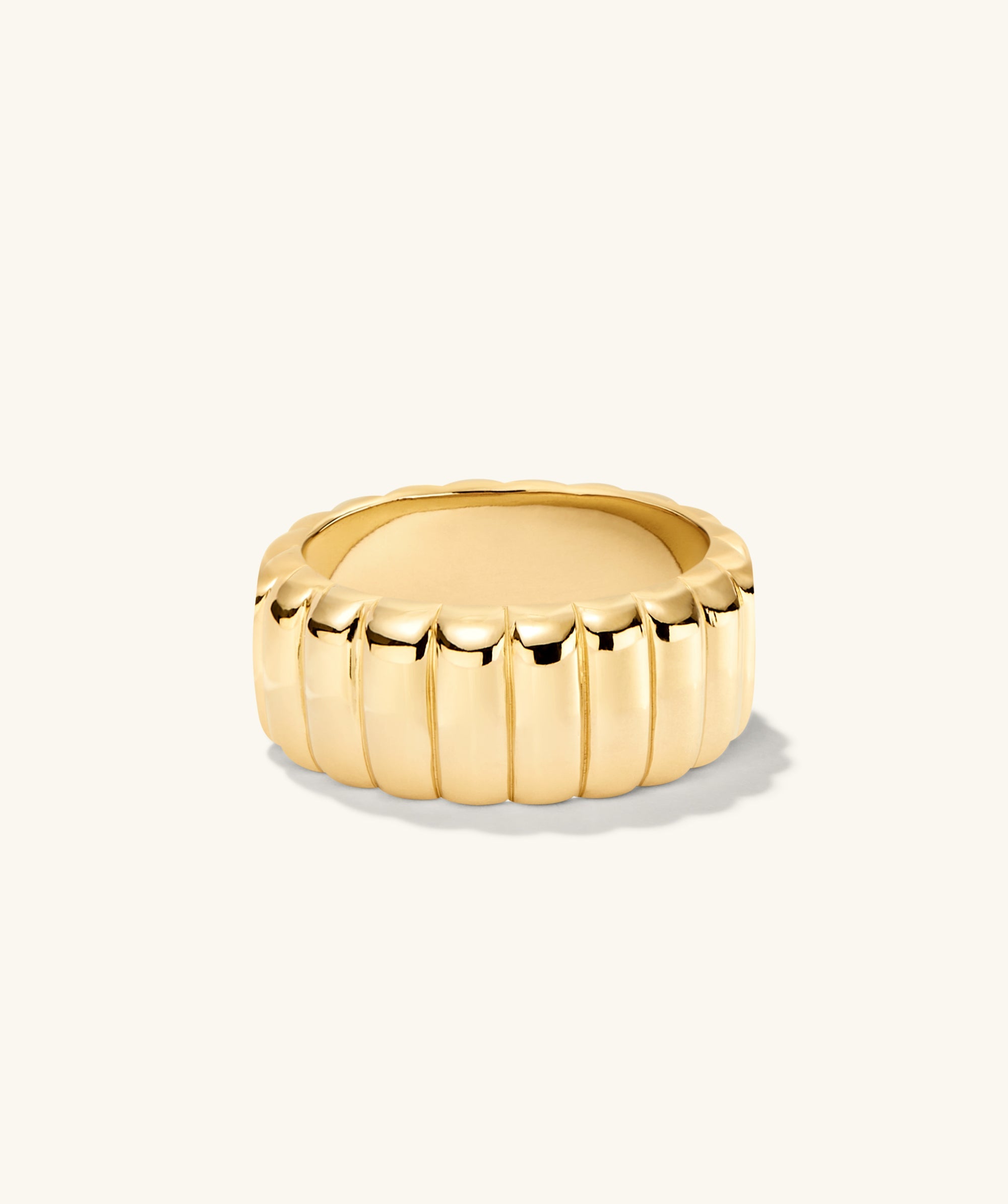 Gold ring with scalloped edge and curved design, inspired by French dessert. Named Charlotte Bold Ring, perfect for adding elegance to your collection.