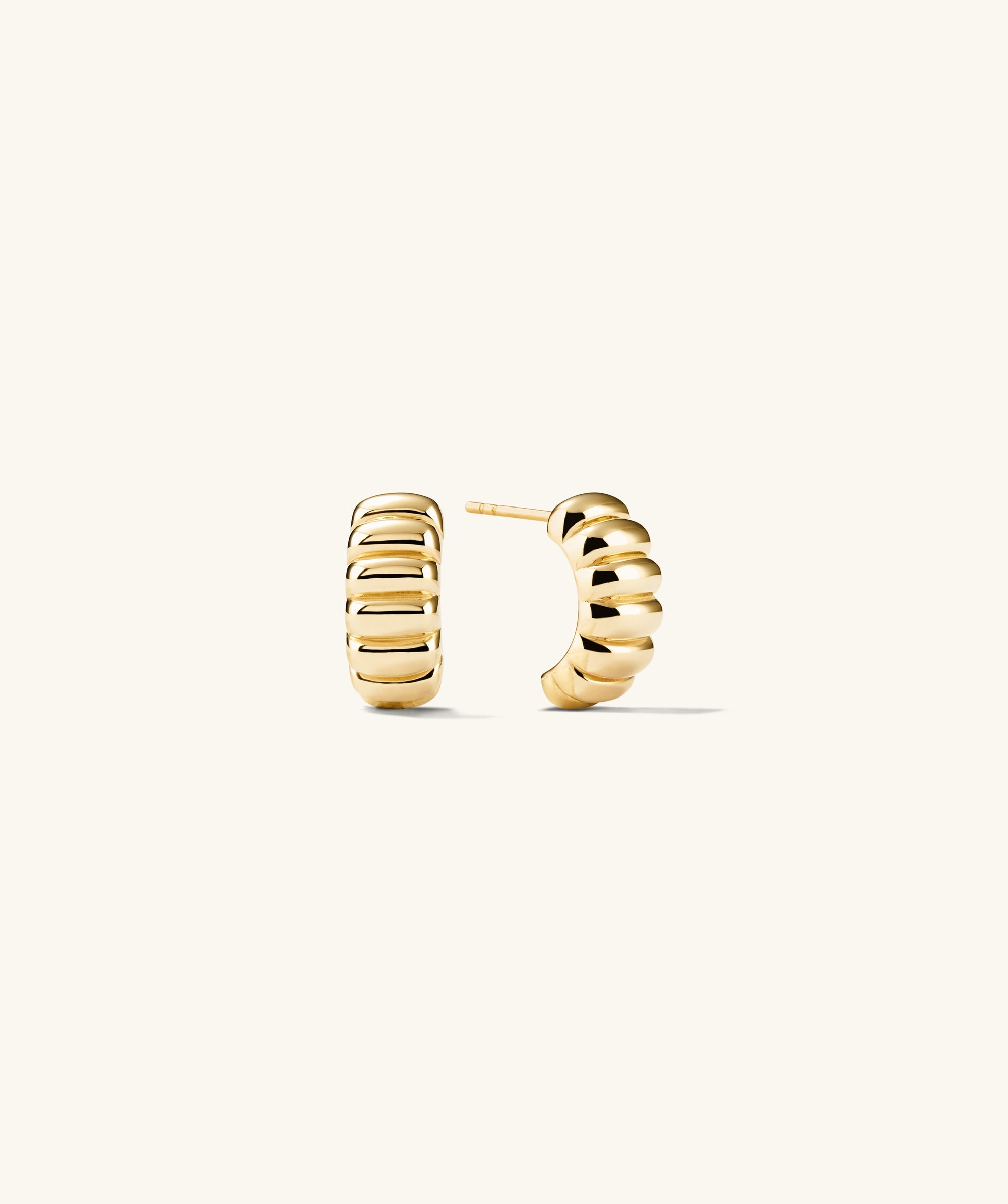 Charlotte Hoops: A pair of elegant gold earrings inspired by the iconic French dessert, adding a sweet touch to your style.